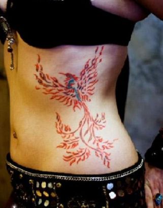 Tribal Phoenix Pic Tattoo On Rib Of Girl